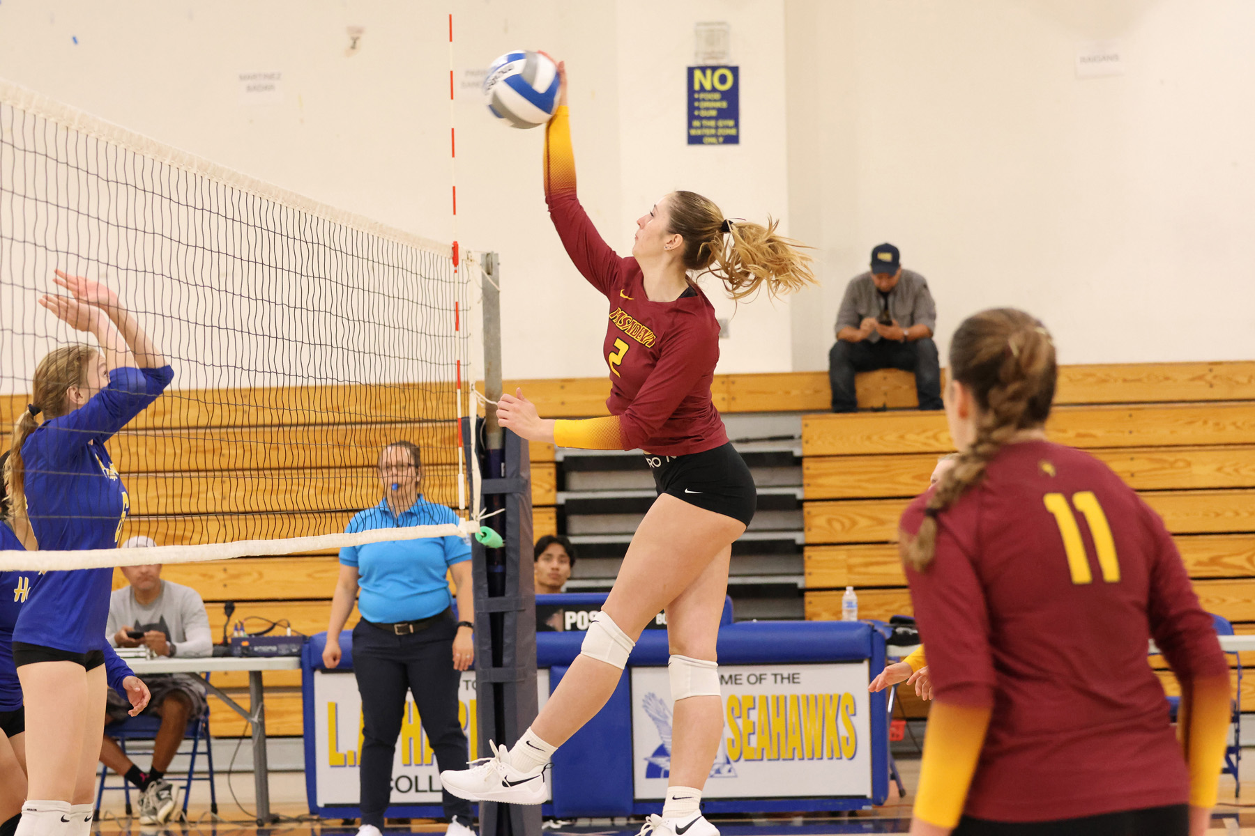 Katie Carius drives home a kill during PCC's conference-openingi win on Wednesday at LA Harbor (photo by Richard Quinton).