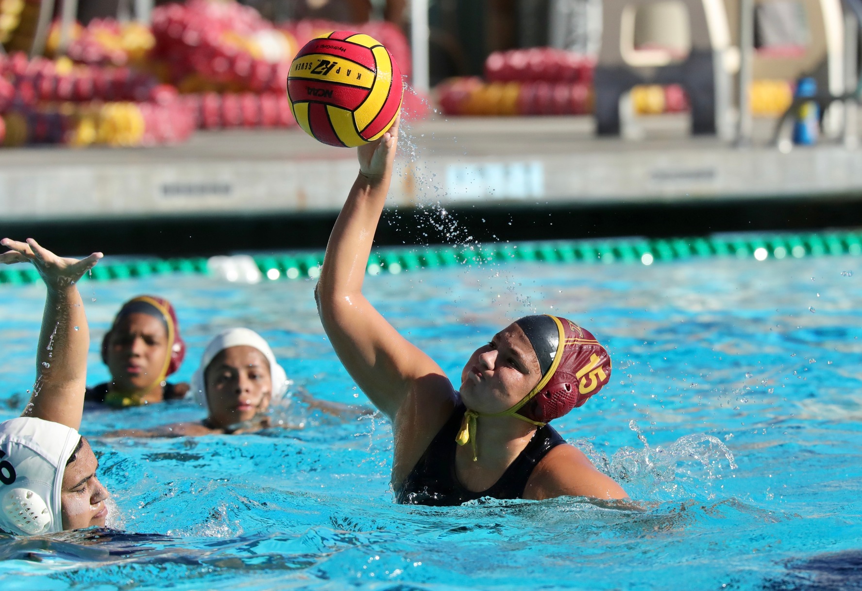 Lancer Fernandez Alvarez fires in one of her three goals in Wednesday's victory at the PCC Aquatic Center, photo by Michael Watkins.