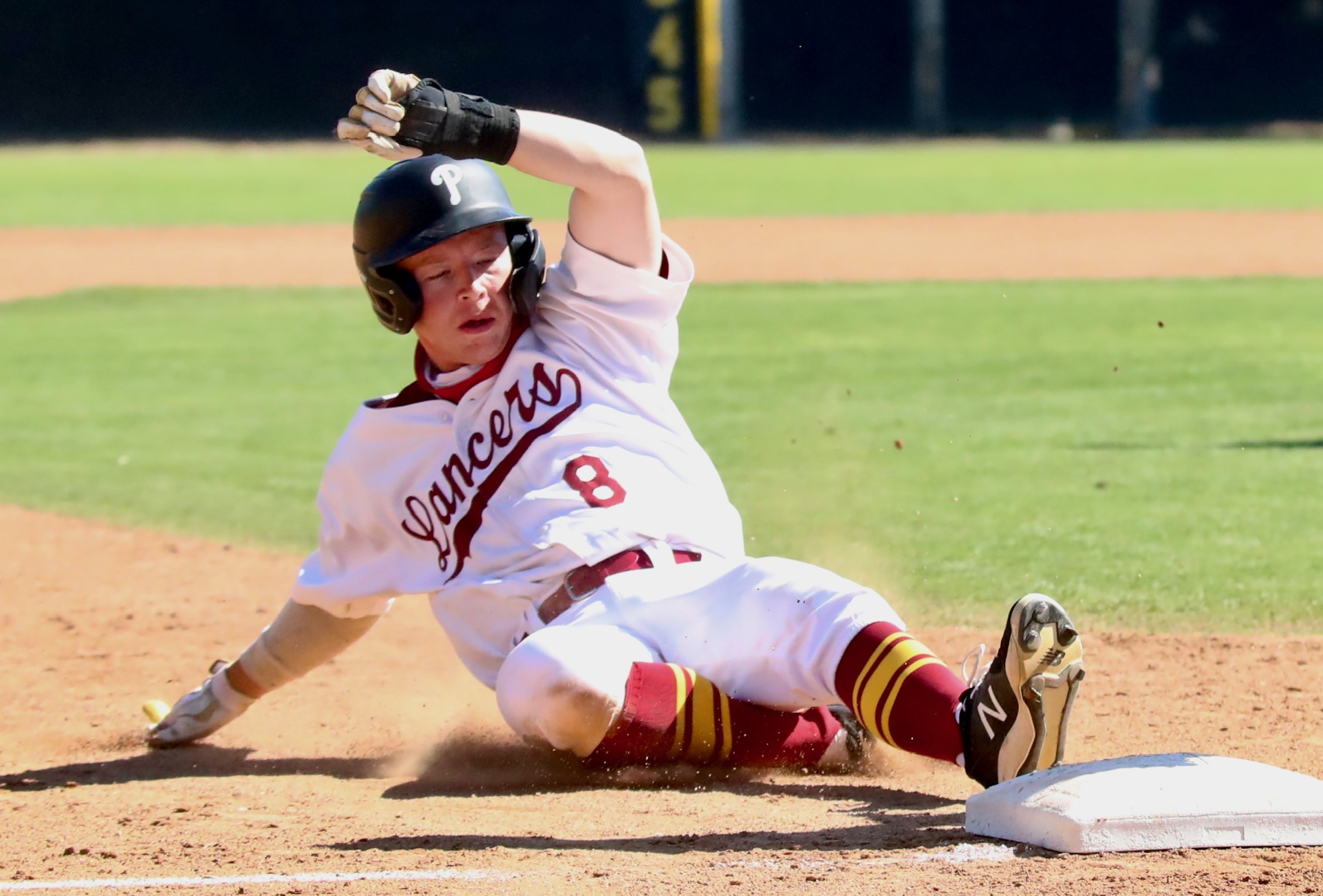 Max Blessinger slides into third base during PCC's win over Victor Valley on Thursday (photo by Michael Watkins, PCC Athletics).