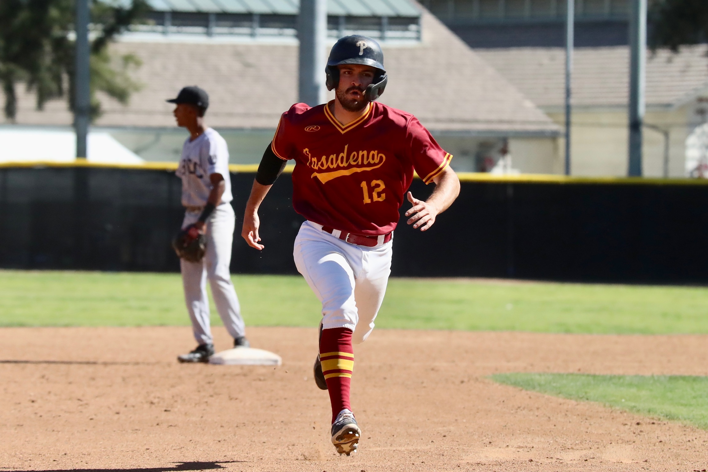 Matt Rice, who batted 4-for-4, races to third base during PCC's win over Long Beach (photo by Michael Watkins, Athletics).