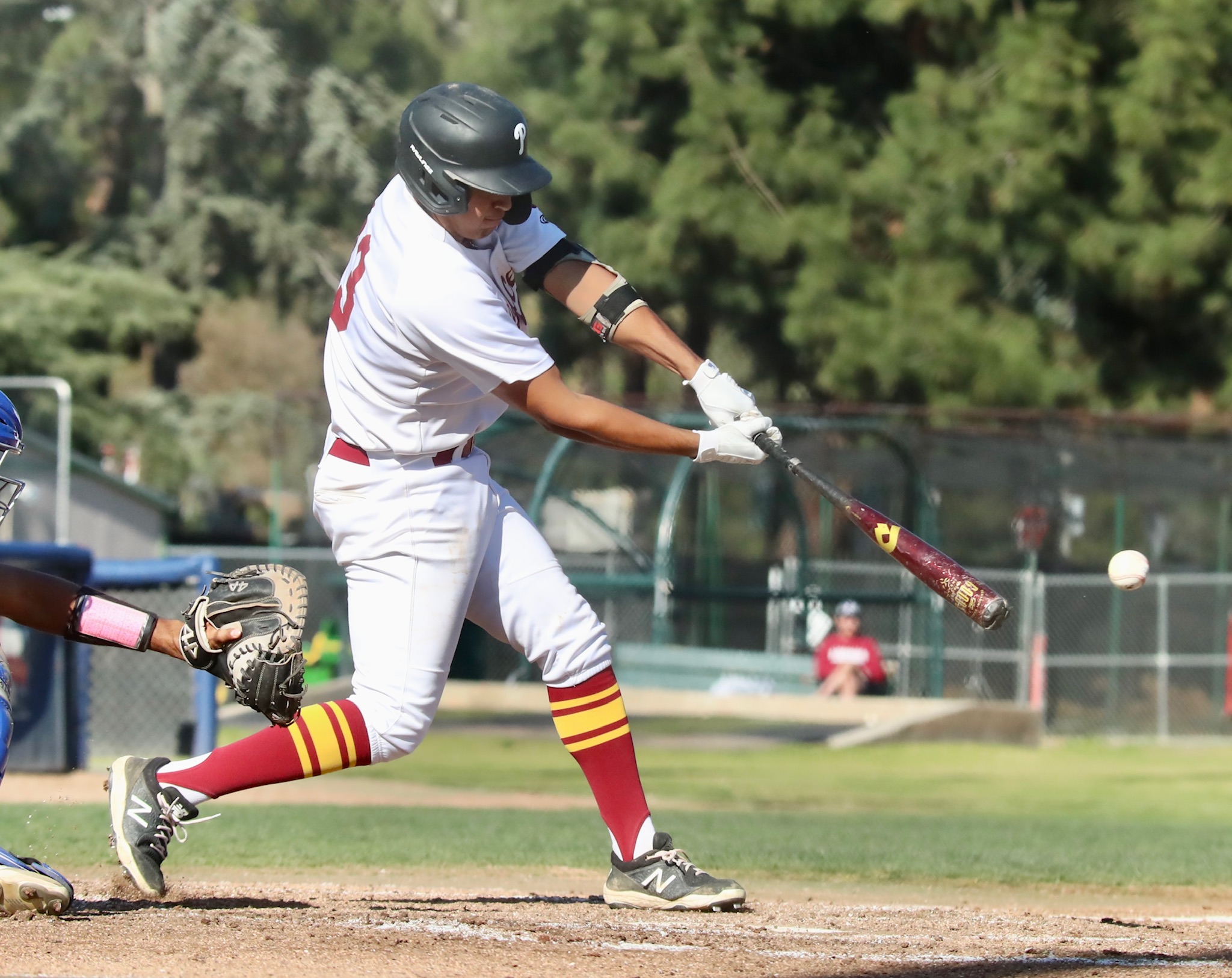 Raider Tello lines one of his five hits during PCC's 17-1 win over LA Harbor on Monday (photo by Michael Watkins, Athletics).