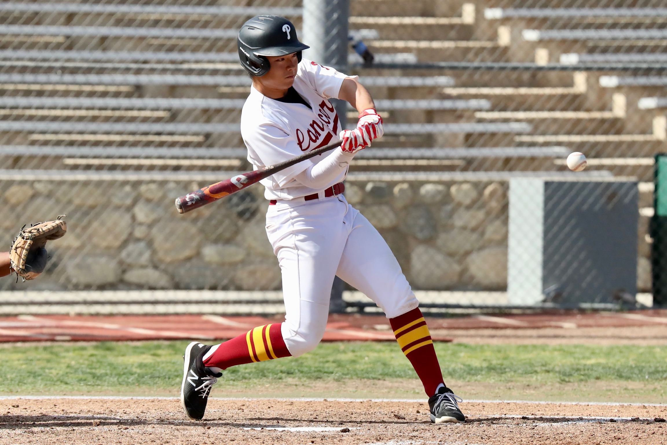 Toshiki Kuriya connects on his home run during PCC's win on Tuesday (photo by Michael Watkins, PCC Athletics).