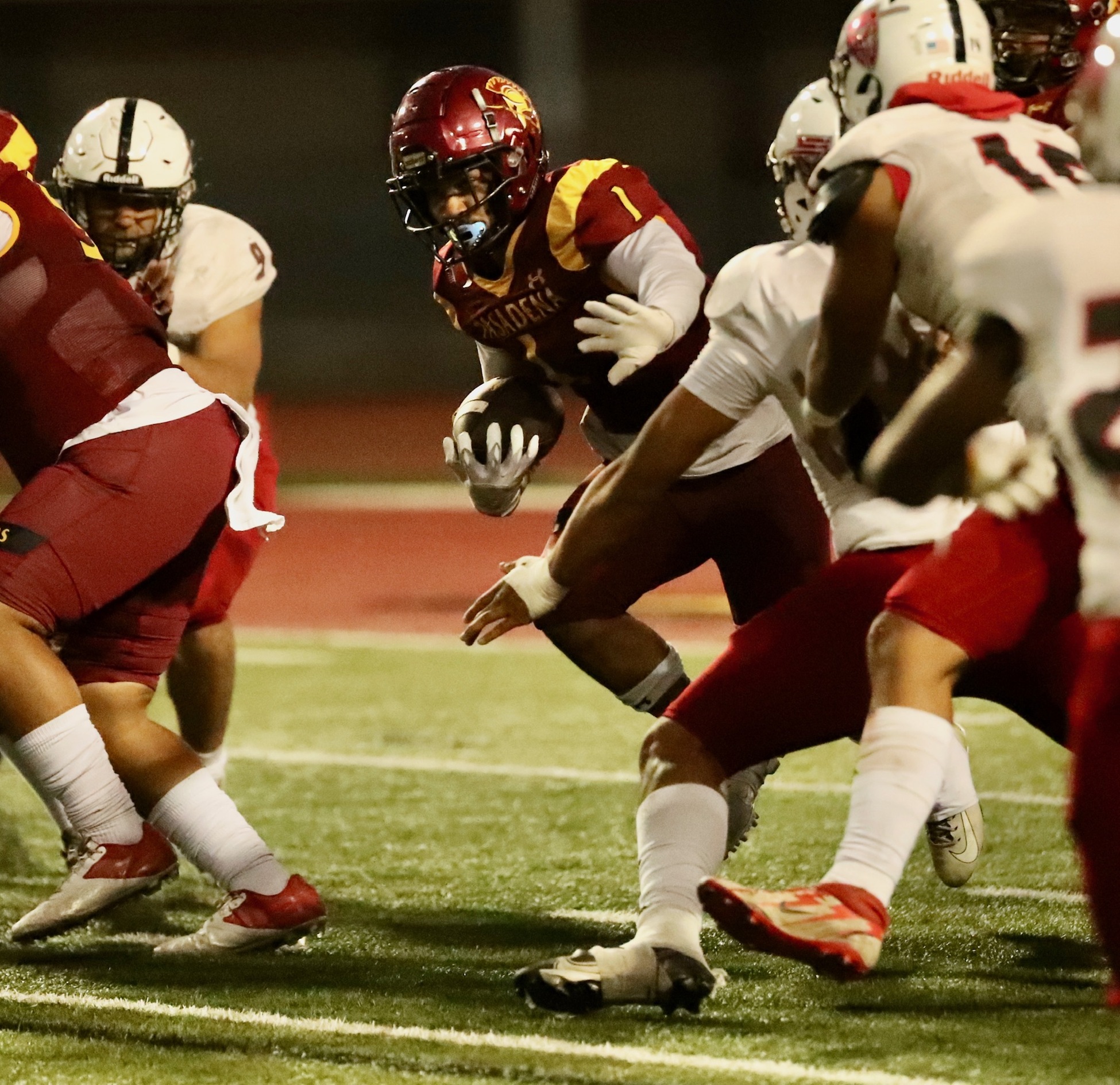 Isaac Glover carries the ball during PCC's win over Santa Ana on Saturday night (photo by Michael Watkins).