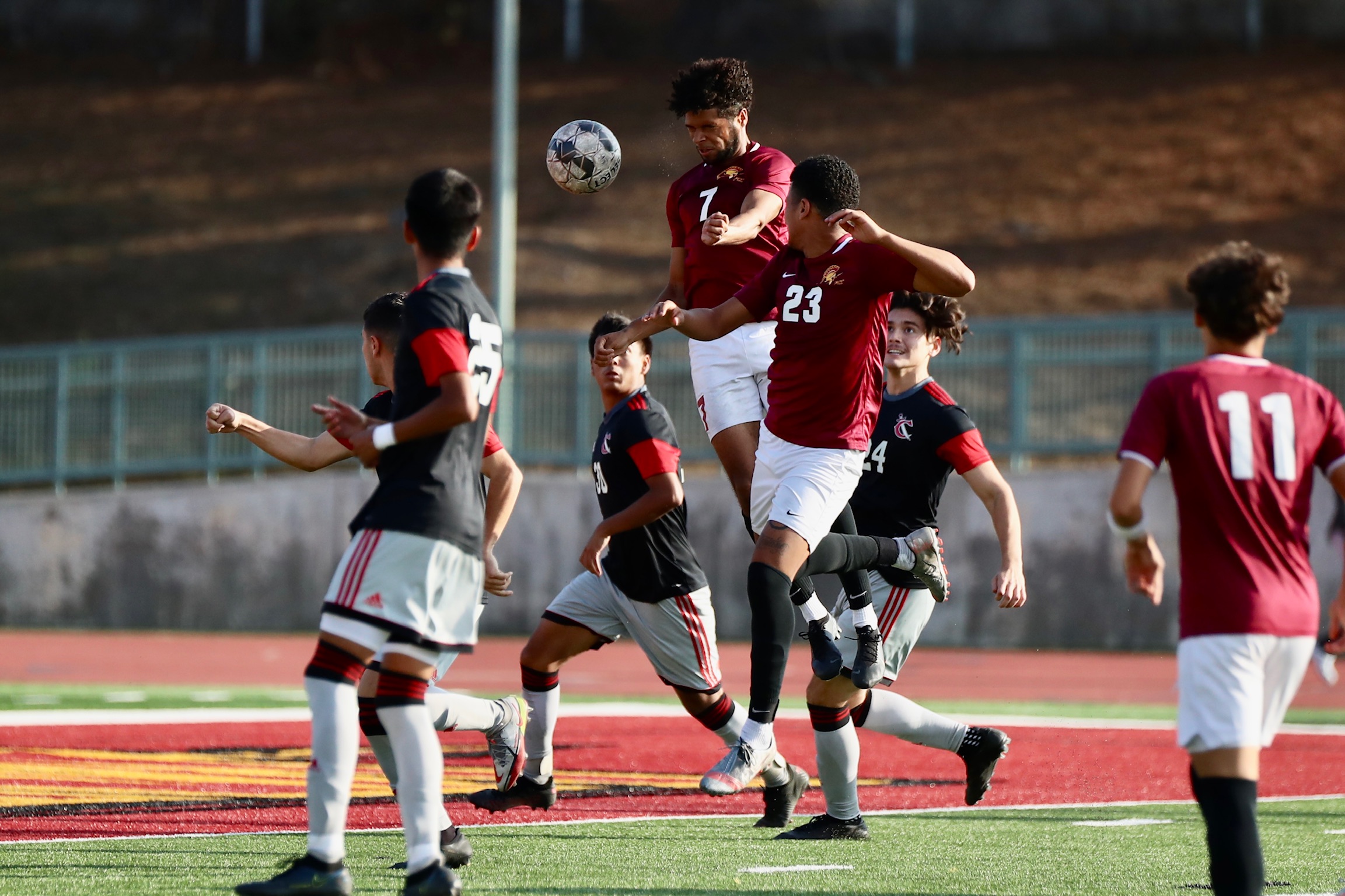 Asher Smith heads in what what proved to be the final PCC goal of the season on Tuesday with teammate Cameron Montano (#23) also in flight (photo by Michael Watkins).