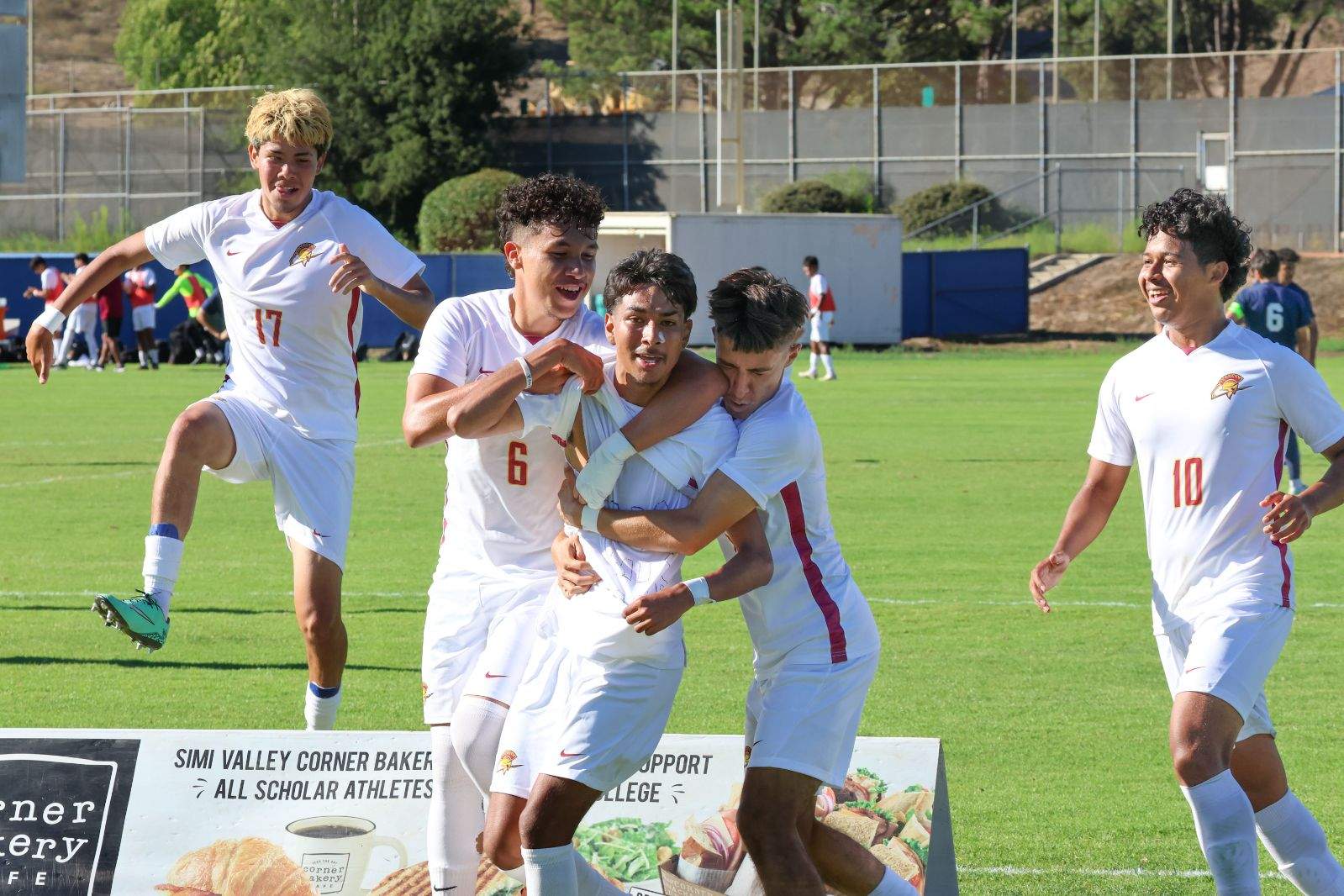 Teammates celebrate after Eduardo Sanchez (center) scored a goal in PCC's men's soccer win at Moorpark Friday (photo by Richard Quinton).