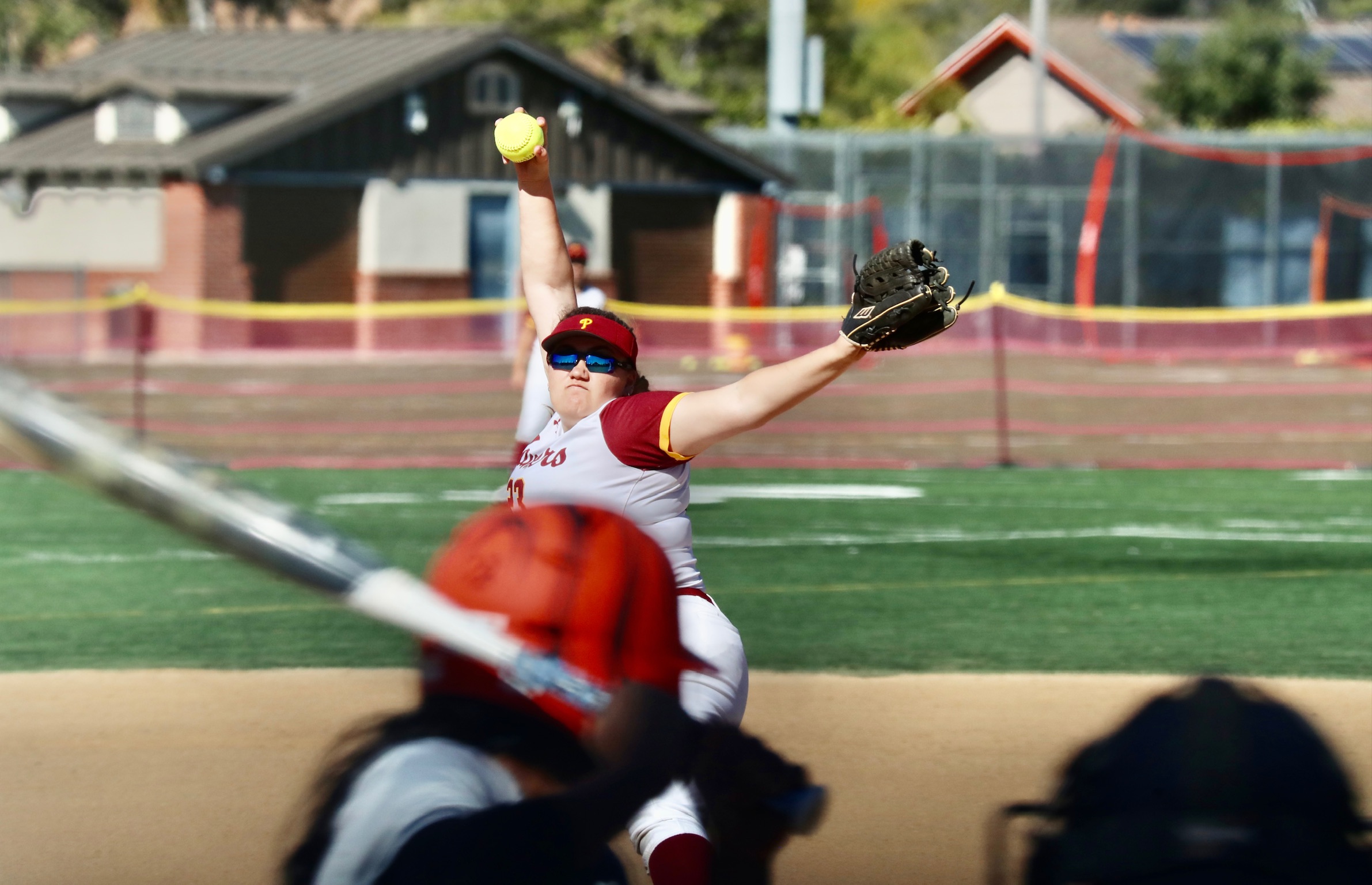 Lancers hurler Kiley Kraft fires a pitch in a recent game (photo by Michael Watkins, Athletics).