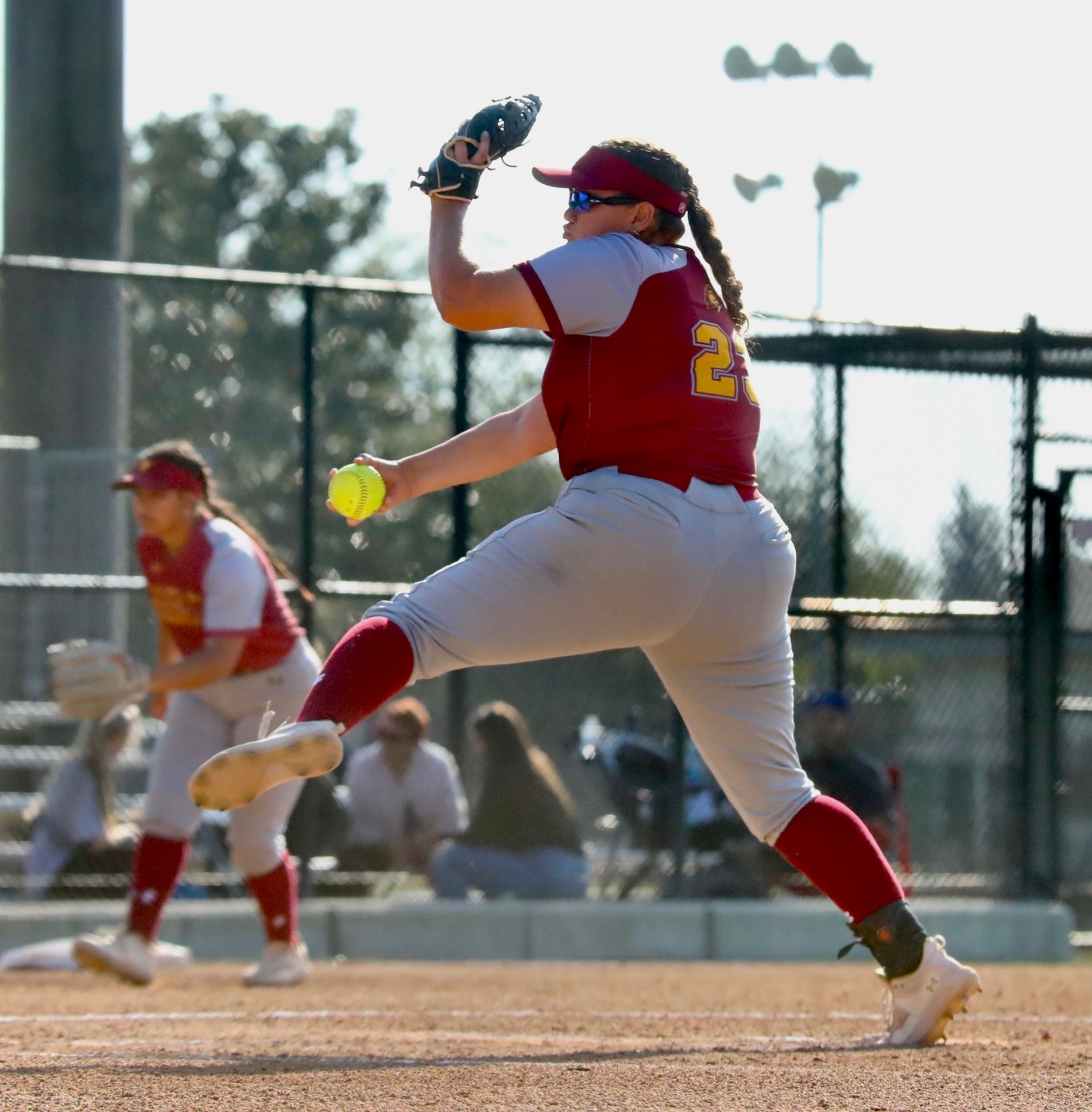 Kiley Kraft delivers a pitch during today's win at Citrus College (photo by Michael Watkins, Athletics).