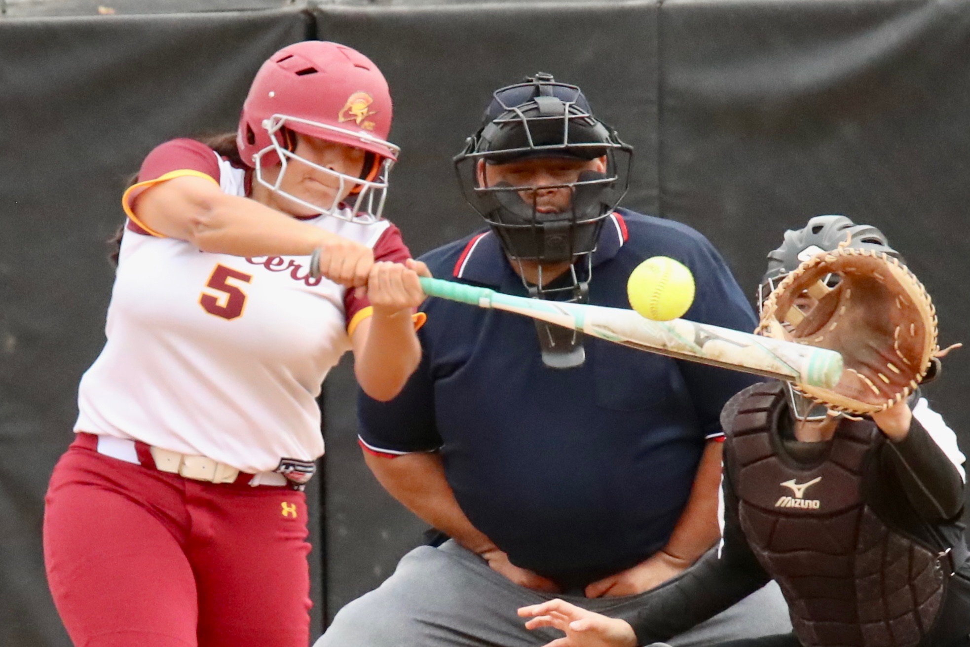 Marcella Ordonez breaks up Palomar pitcher India Caldwell's no-hit bid here in the seventh inning of game 1 of PCC softball's doubleheader on Saturday. (photo by Michael Watkins, Athletics).