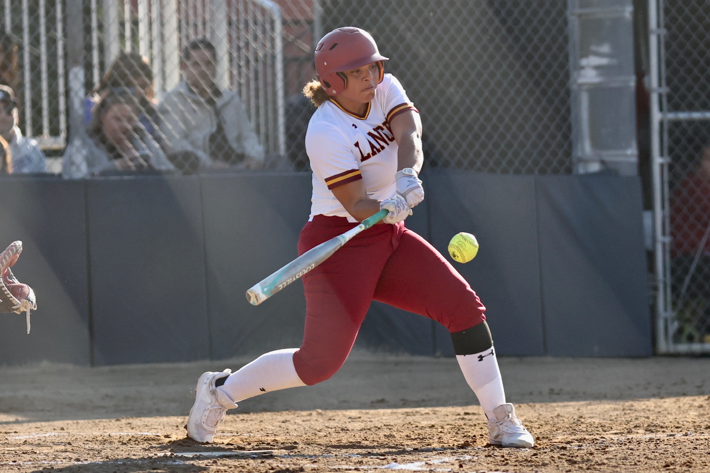 Jaime Harris connects on one of PCC's 13 hits in the team's home-opening victory on Wednesday (photo by Michael Watkins)