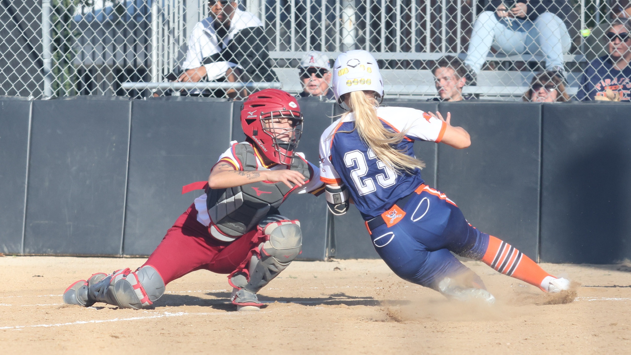 Jennie Chacon places the tag at home during PCC's win over Orange Coast on Monday (photo by Richard Quinton).