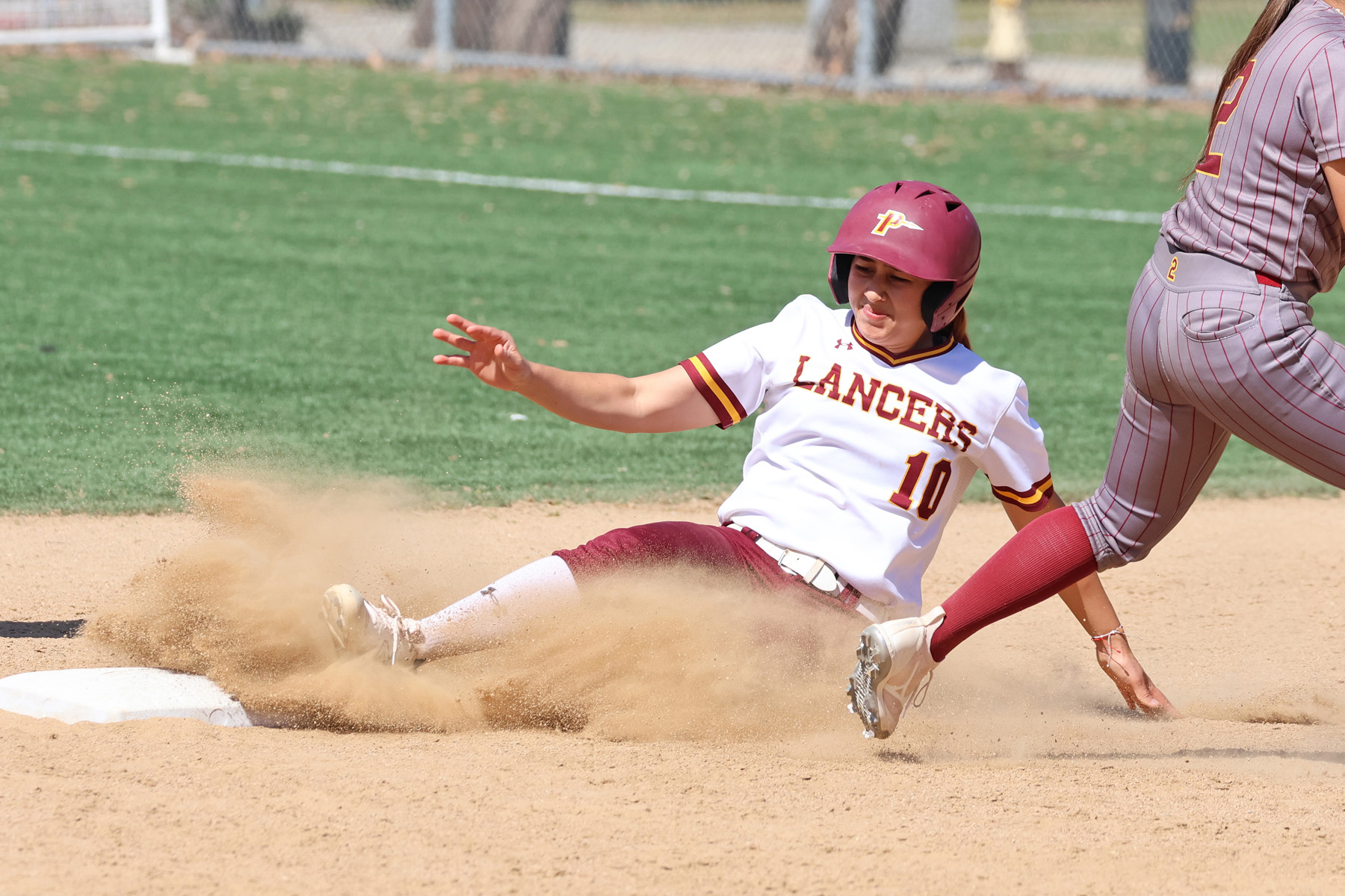 Breanna Negrete slides into second base during PCC's win on Tuesday (photo and gallery by Richard Quinton).