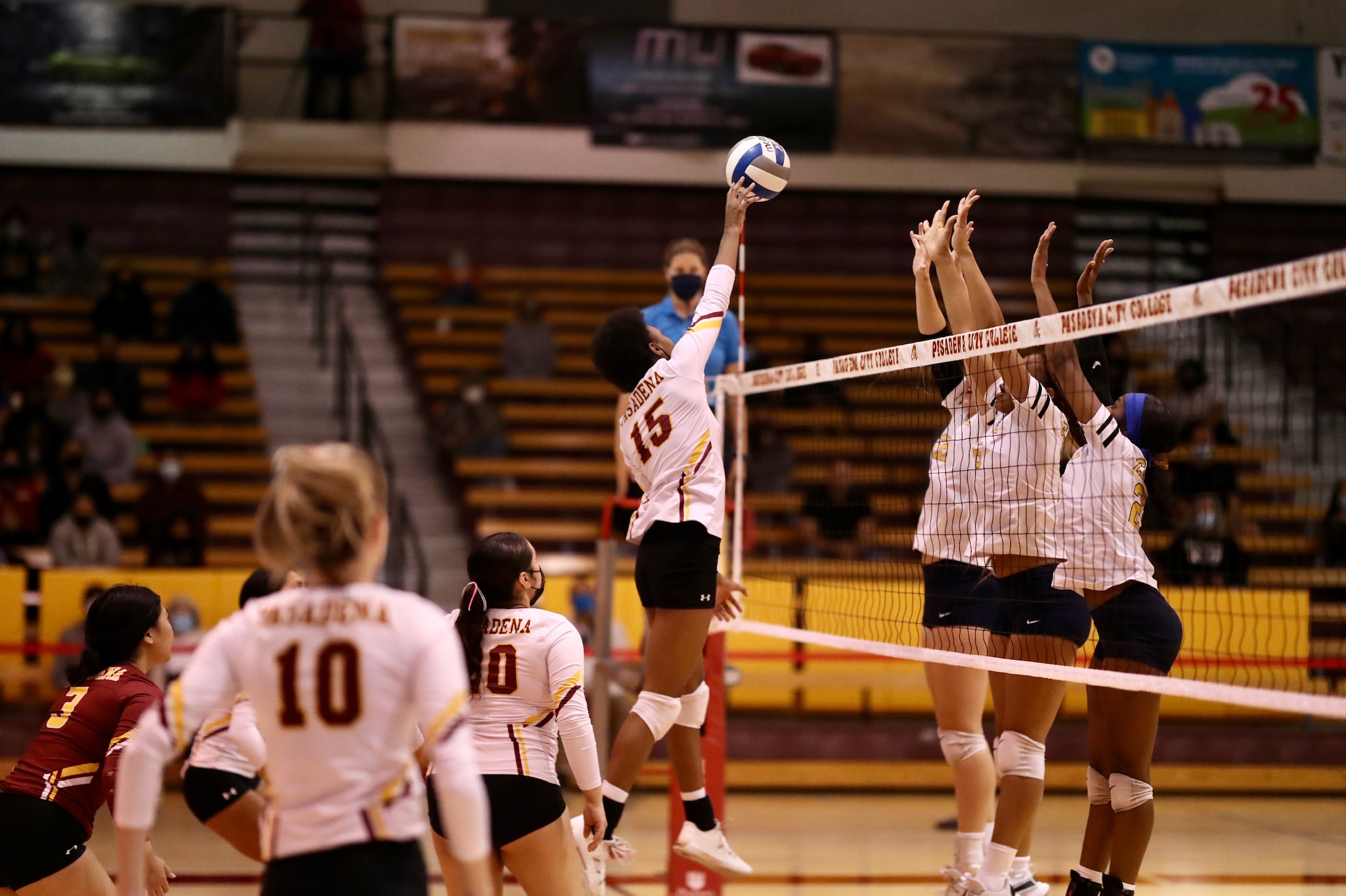 College of the Canyons put up a 3-player blocking wall at times including here v. Lancer Monet Latunde in PCC's Round 1 Regional loss on Tuesday (photo by Michael Watkins).