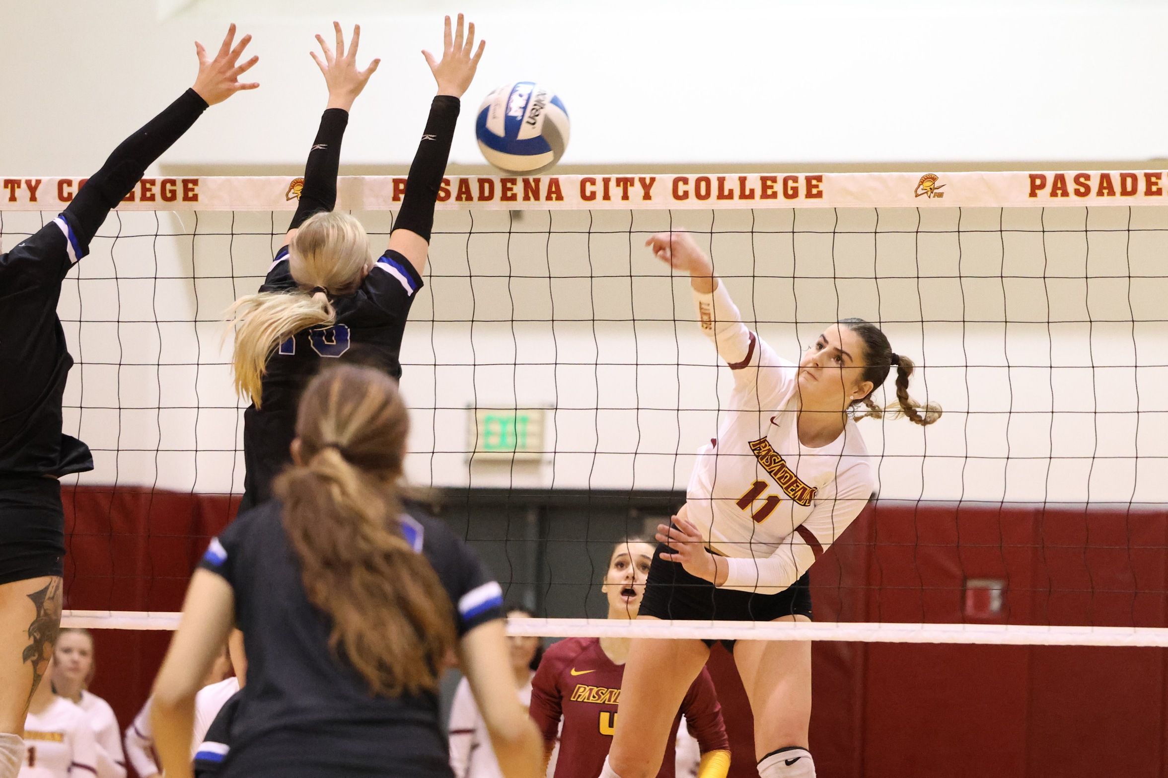 Ashley Marrone powers a kill during PCC's playoff win on Saturday night (photo by Richard Quinton).